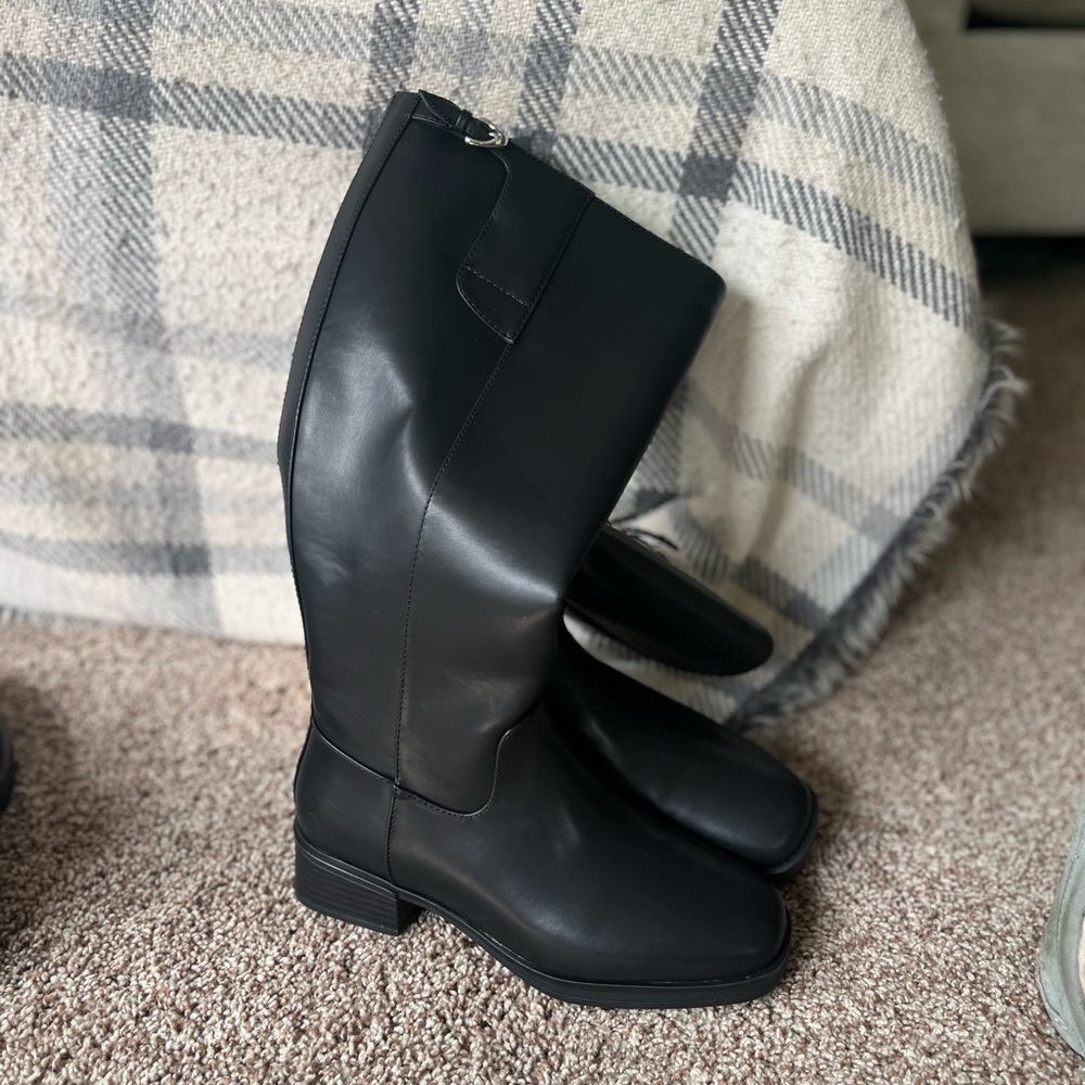 Brand new black new knee high boots.